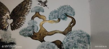 Decorative wall art featuring abstract trees and a bird in muted tones.